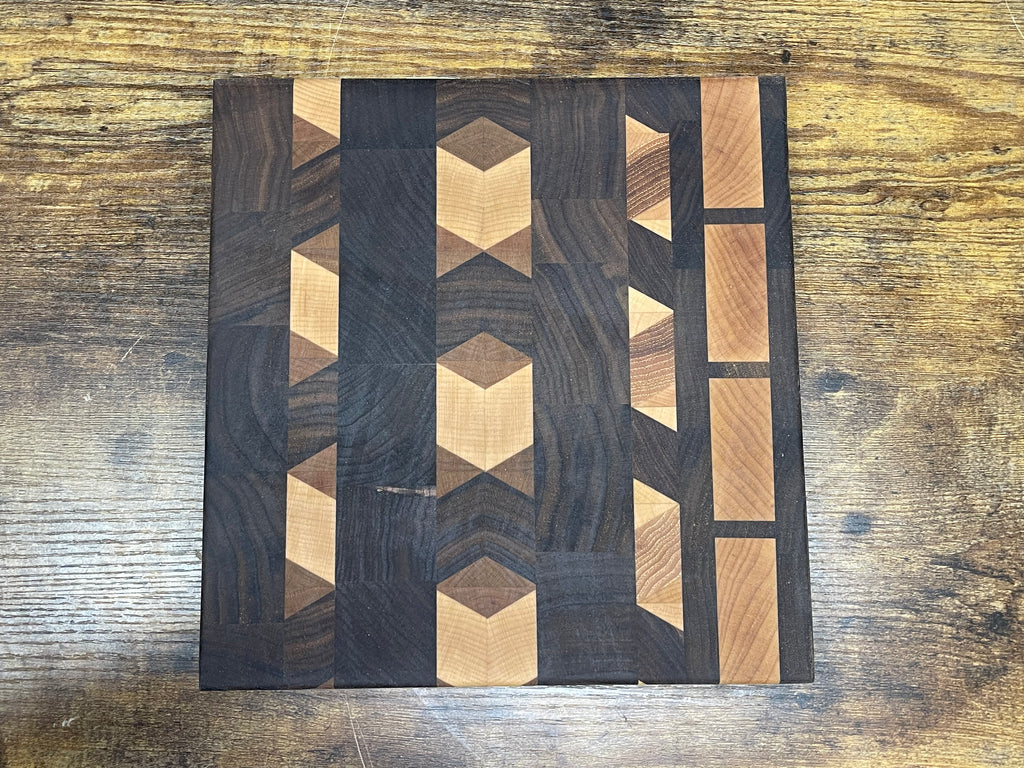 Geometric pattern walnut cutting board