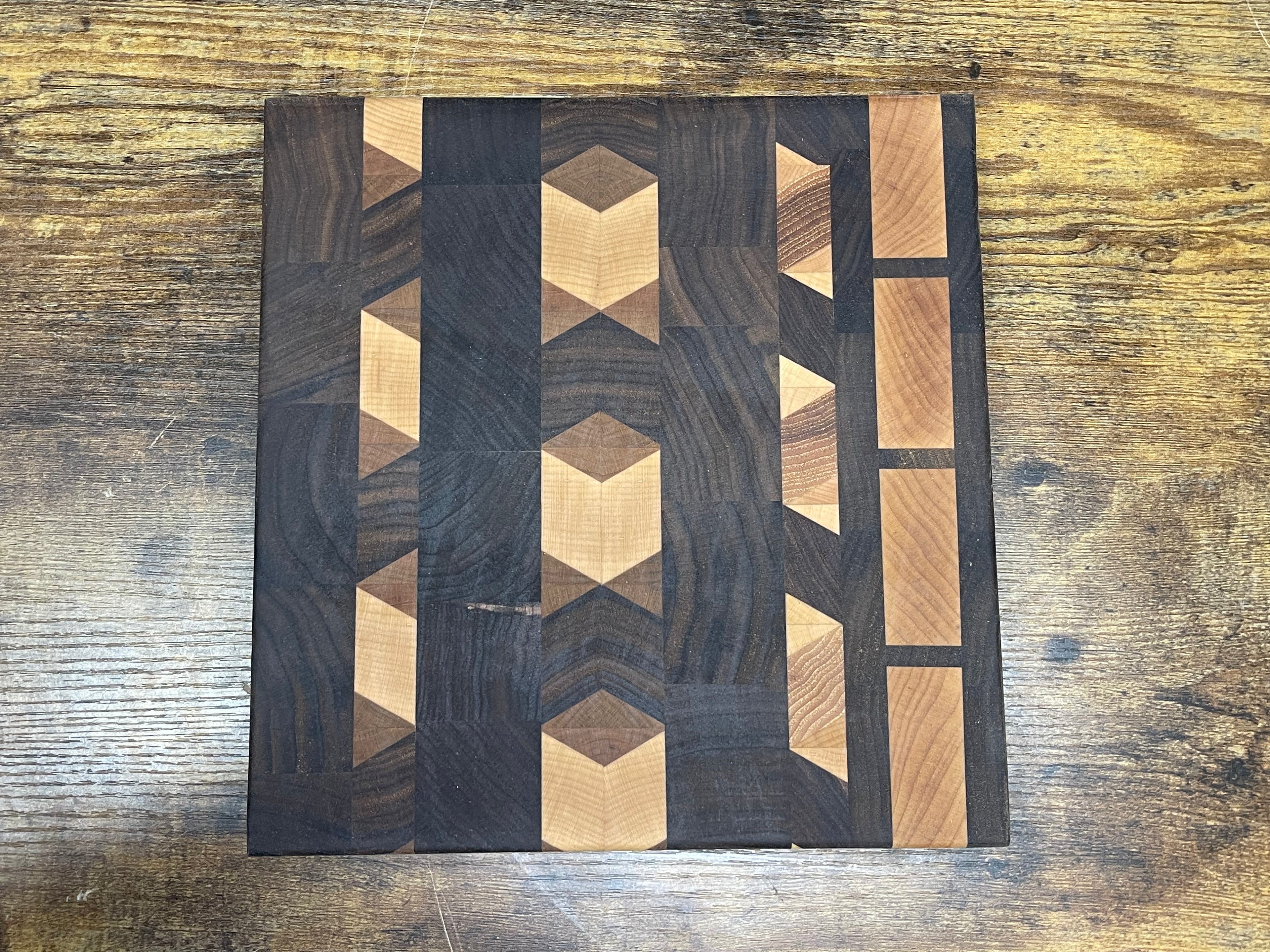 Geometric pattern walnut cutting board
